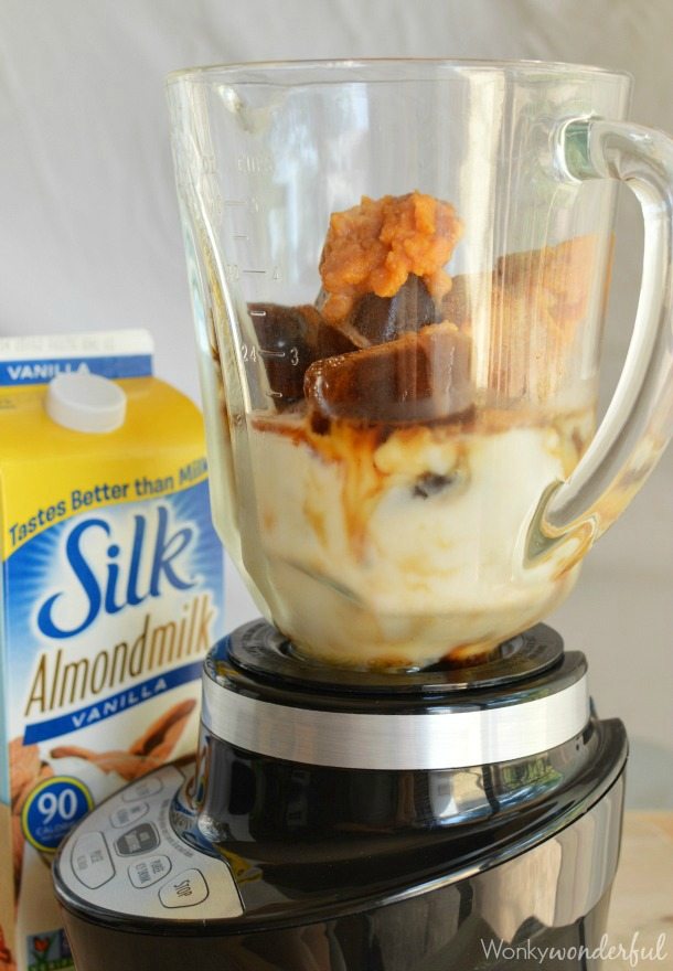 clear glass blender filled with blended coffee ingredients