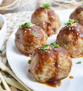 These Saucy Asian Meatballs are perfect for parties! This easy appetizer recipe is a combo of baked meatballs and a sweet ginger sauce that takes just 10 minutes to make.