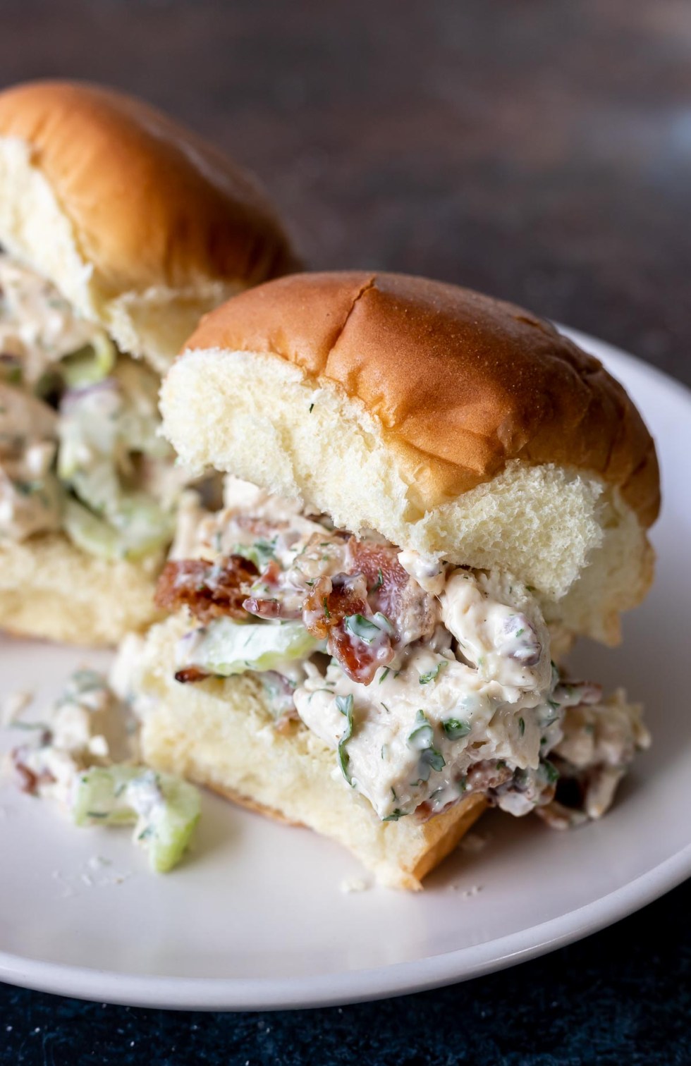 chicken salad on roll served on white plate