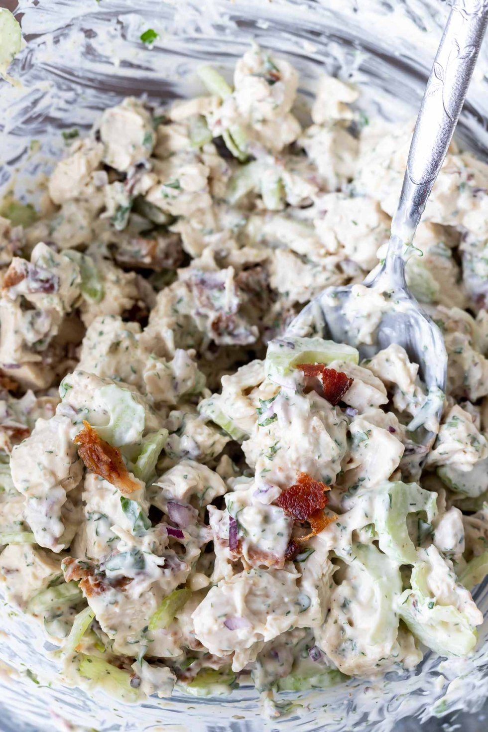 mixed chicken salad in clear glass bowl