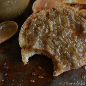 slice of toast topped with nut butter with bite taken out