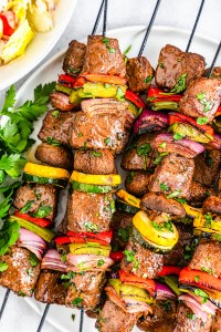 cooked steak and veggies on metal skewers