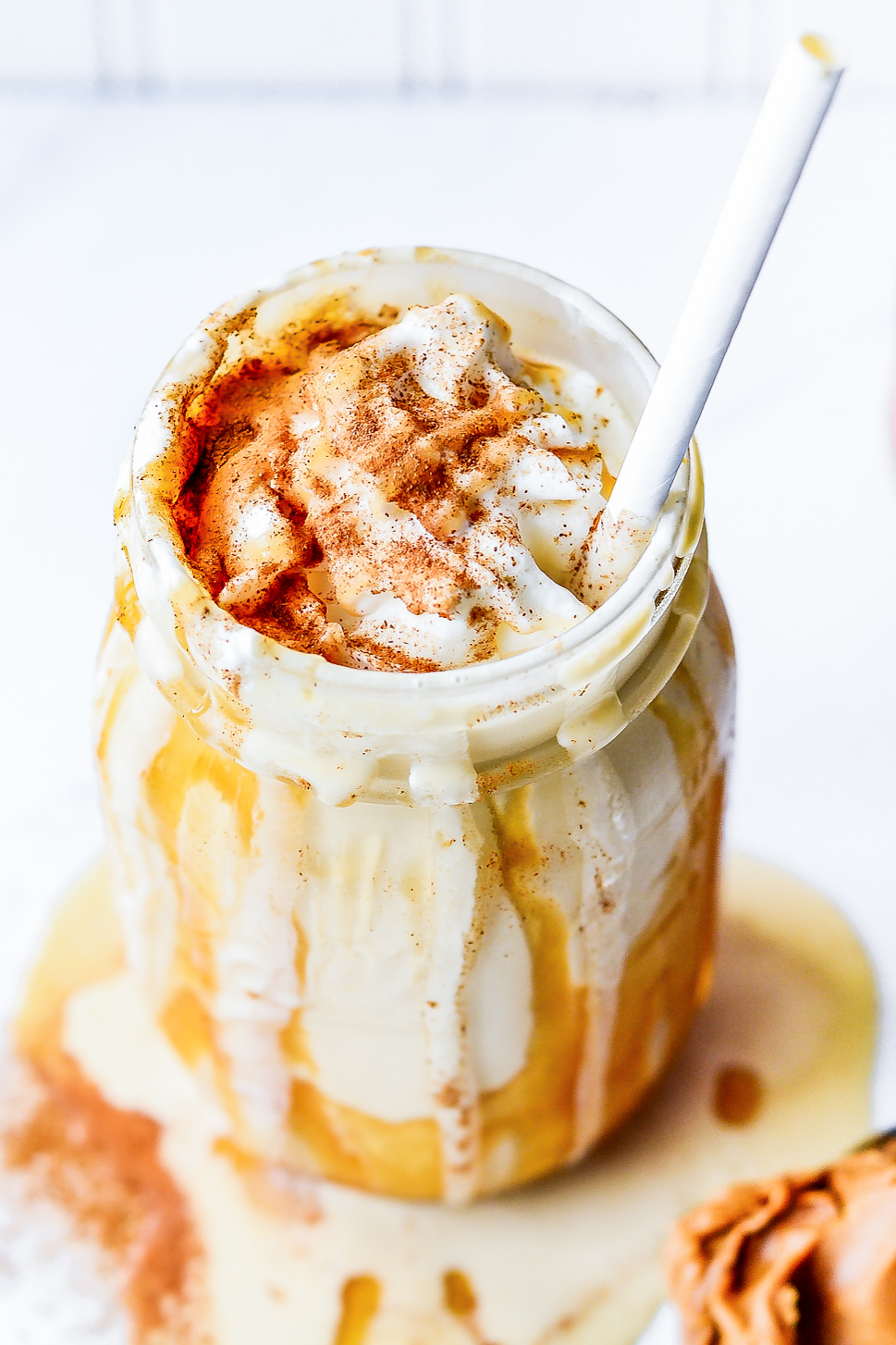 melty milkshake in glass jar with straw