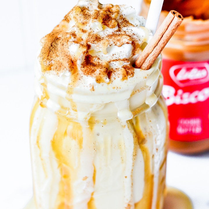 prepared milkshake next to cookie butter jar