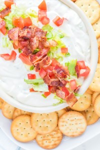 dip topped with bacon lettuce ands tomato