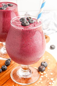 purple drink in glass with straw