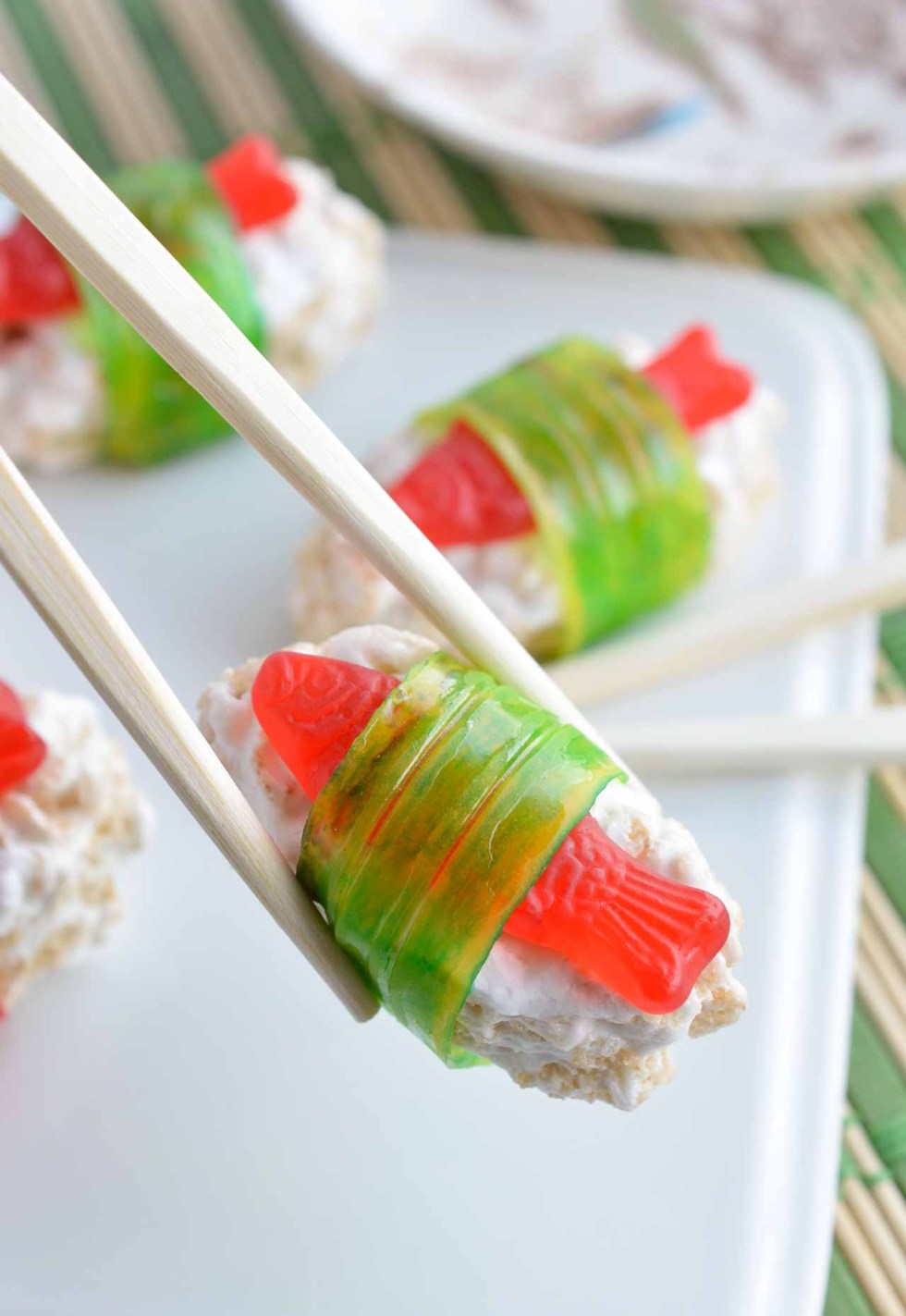 chopsticks holding sushi made from candy