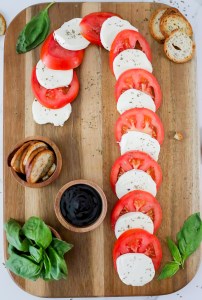 mozzarella and tomato slices on shape of candy cane