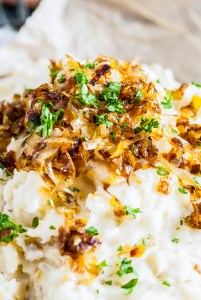 golden browned leeks on top of mashed potatoes