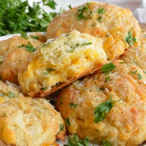 Cheddar Bay Drop Biscuits are full of flavor and light as air. These are inspired by your favorite Red Lobster Biscuits Recipe with cheddar cheese, fresh parsley and Old Bay Seasoning. Perfect for a quick dinner side dish or holiday feasts!