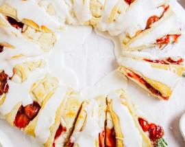 prepared pastry wreath with cherries and rosemary