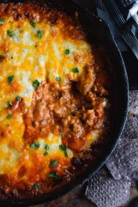 Easy Cheesy Chili Dip is the ultimate appetizer! Make this Homemade Chili Cheese Dip Recipe for parties, holidays or game day.