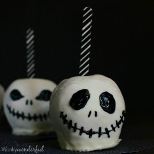 decorated white chocolate covered apples with black and white striped sticks