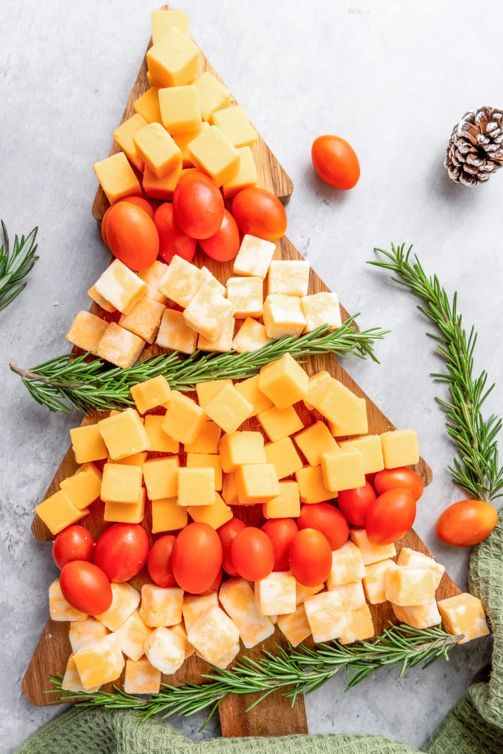 cheese tomatoes and rosemary in shape of tree