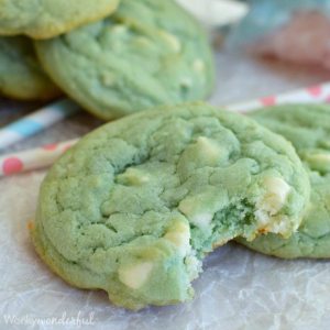 light blue cookie with white chocolate chips, bite taken out