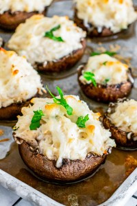 brown mushroom filled with creamy mixture topped with parsley