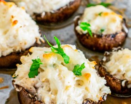 brown mushroom filled with creamy mixture topped with parsley