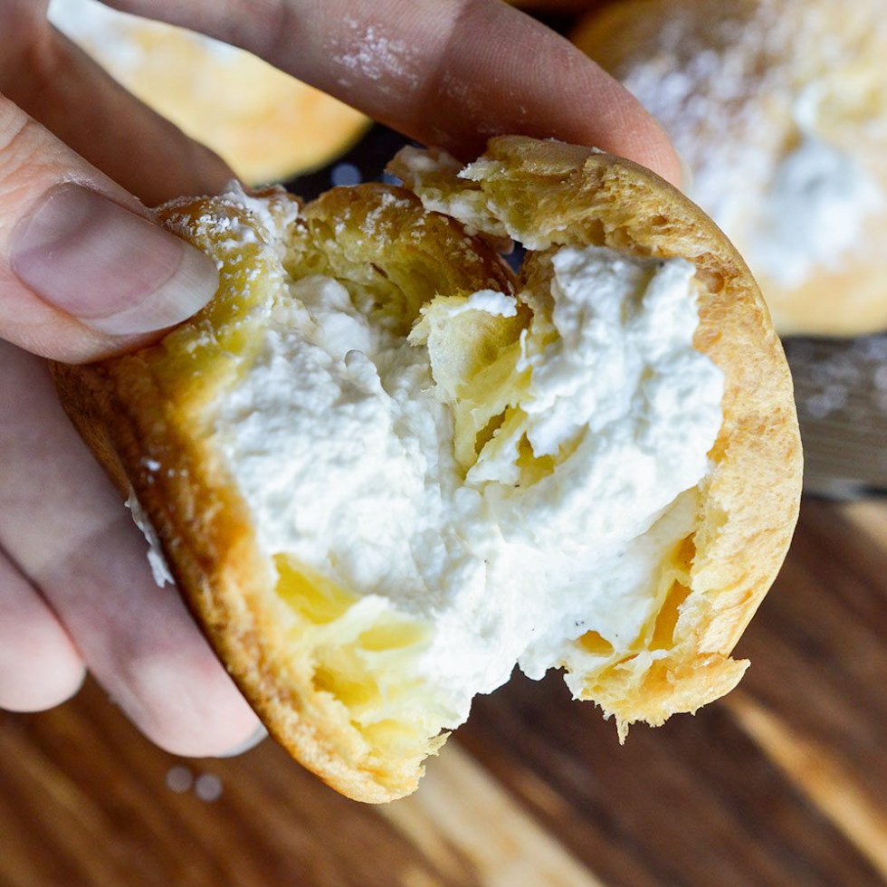 hand holding cream filled puff