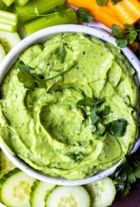 bright green and creamy avocado dip recipe topped with fresh cilantro