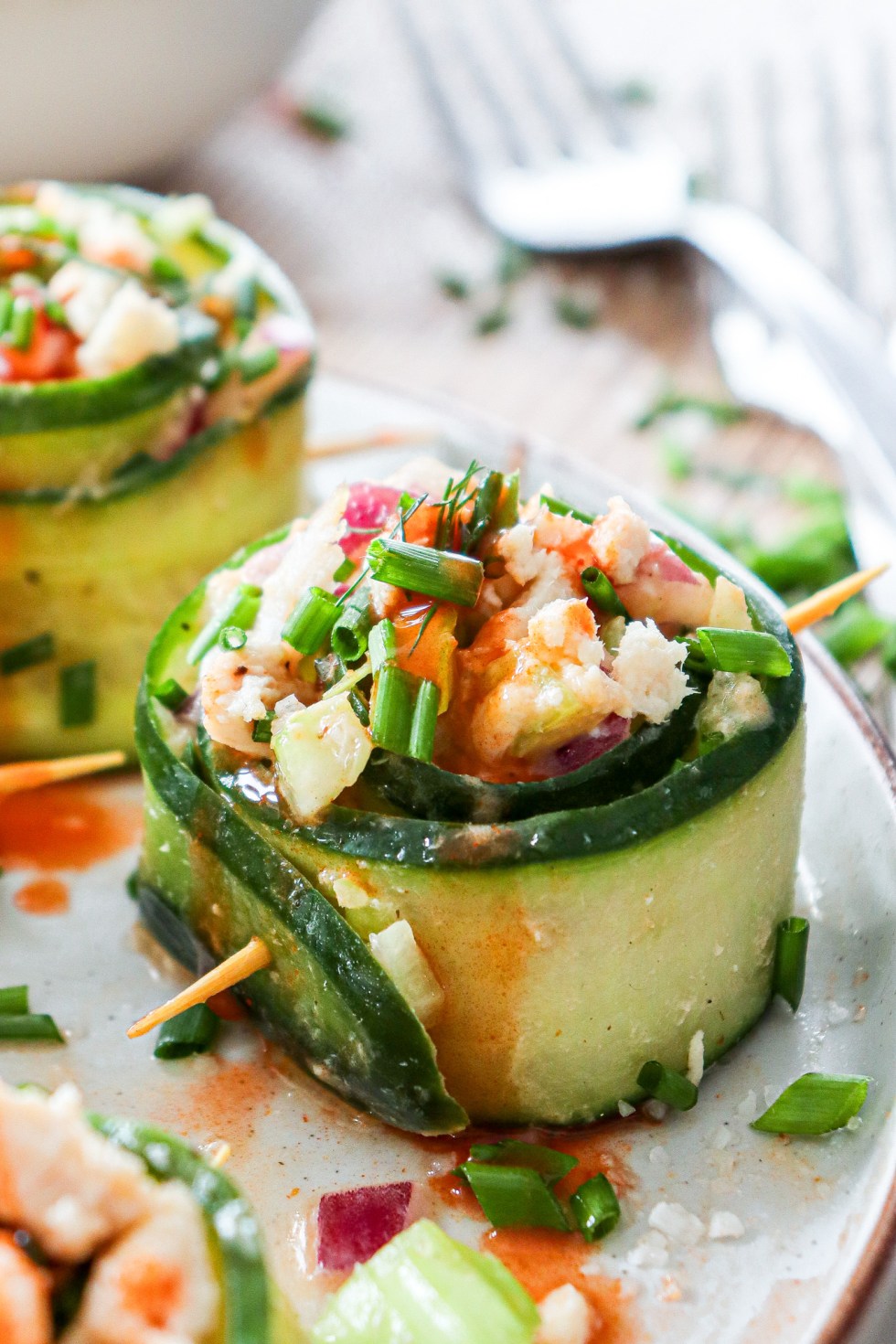 prepared cucumber roll up on white plate