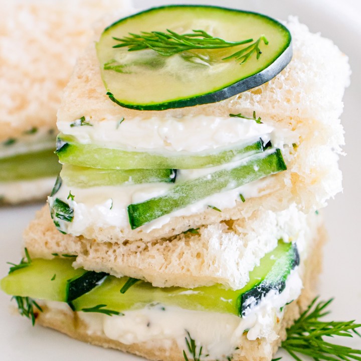 two mini sandwich squares stacked on plate