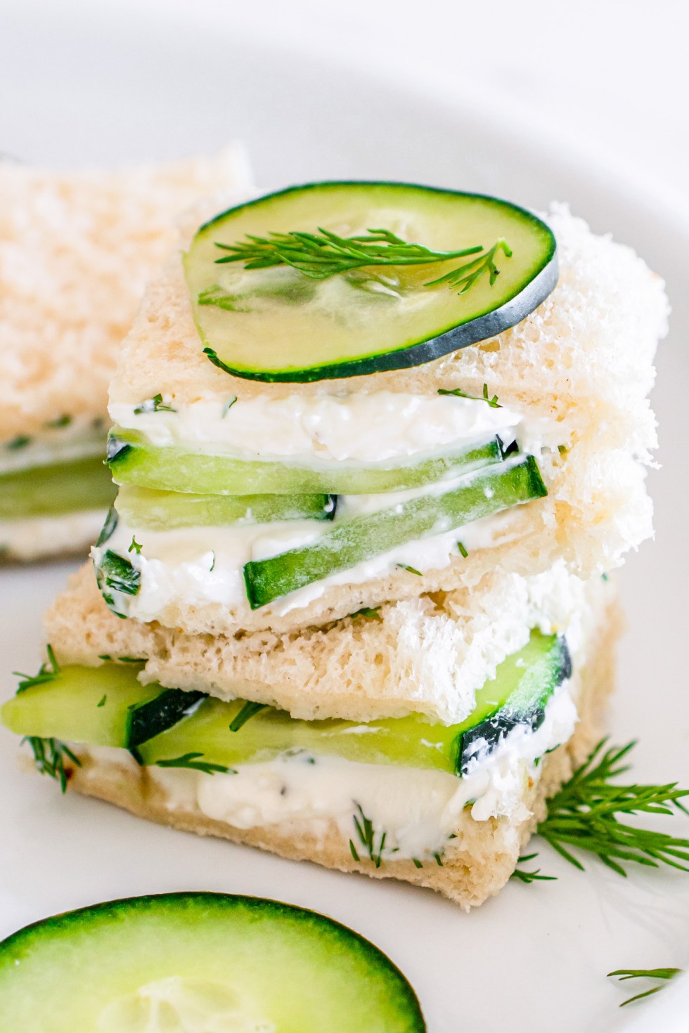 two mini sandwich squares stacked on plate