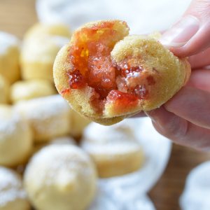 Want pancakes for breakfast without all the flipping? This Baked Dairy Free Pancake Muffins Recipe is super easy to make and great for feeding a hungry crowd! Not only are these pancake bites light and fluffy, they are also filled with strawberry jam!