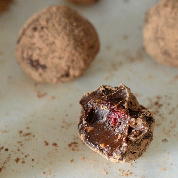 truffle with bite taken out showing piece of cranberry inside