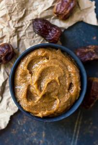 smooth date paste in black bowl with dates on the side