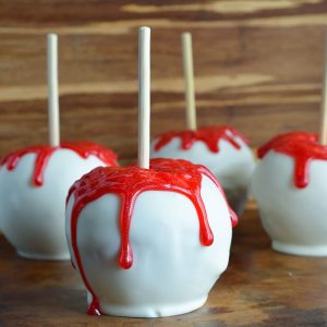 Bloody White Chocolate Apples are quick, easy and SPOOKY! This fun Halloween recipe will be a hit with kids and adults!