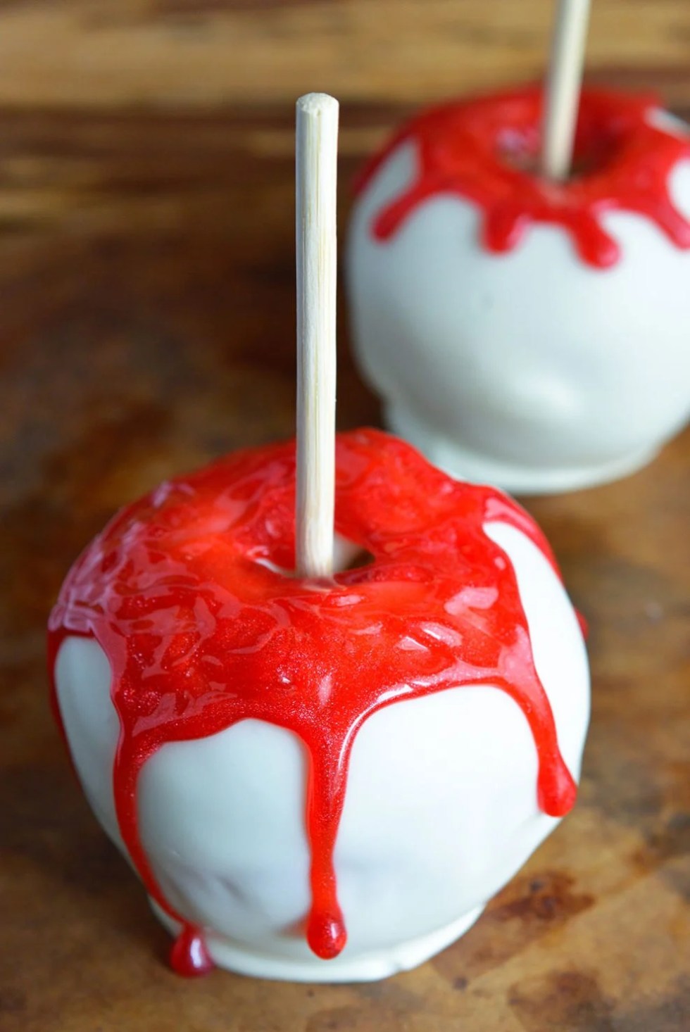 Bloody White Chocolate Apples are quick, easy and SPOOKY! This fun Halloween recipe will be a hit with kids and adults! Your Halloween Party guests will be screaming for more!