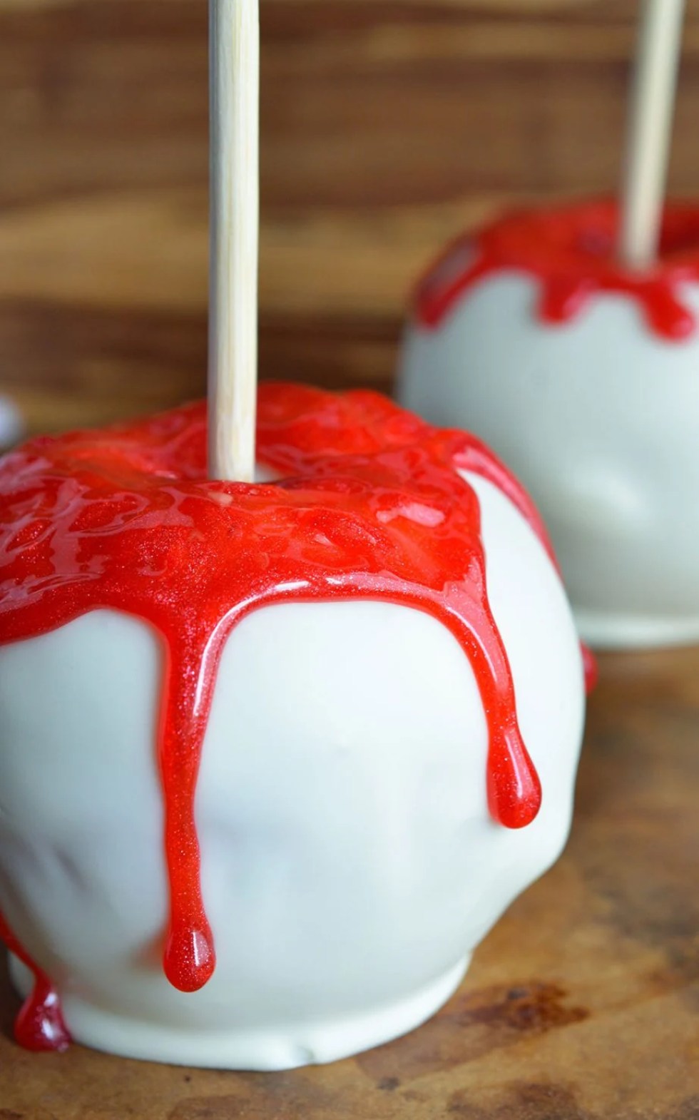 Bloody White Chocolate Apples are quick, easy and SPOOKY! This fun Halloween recipe will be a hit with kids and adults! Your Halloween Party guests will be screaming for more!