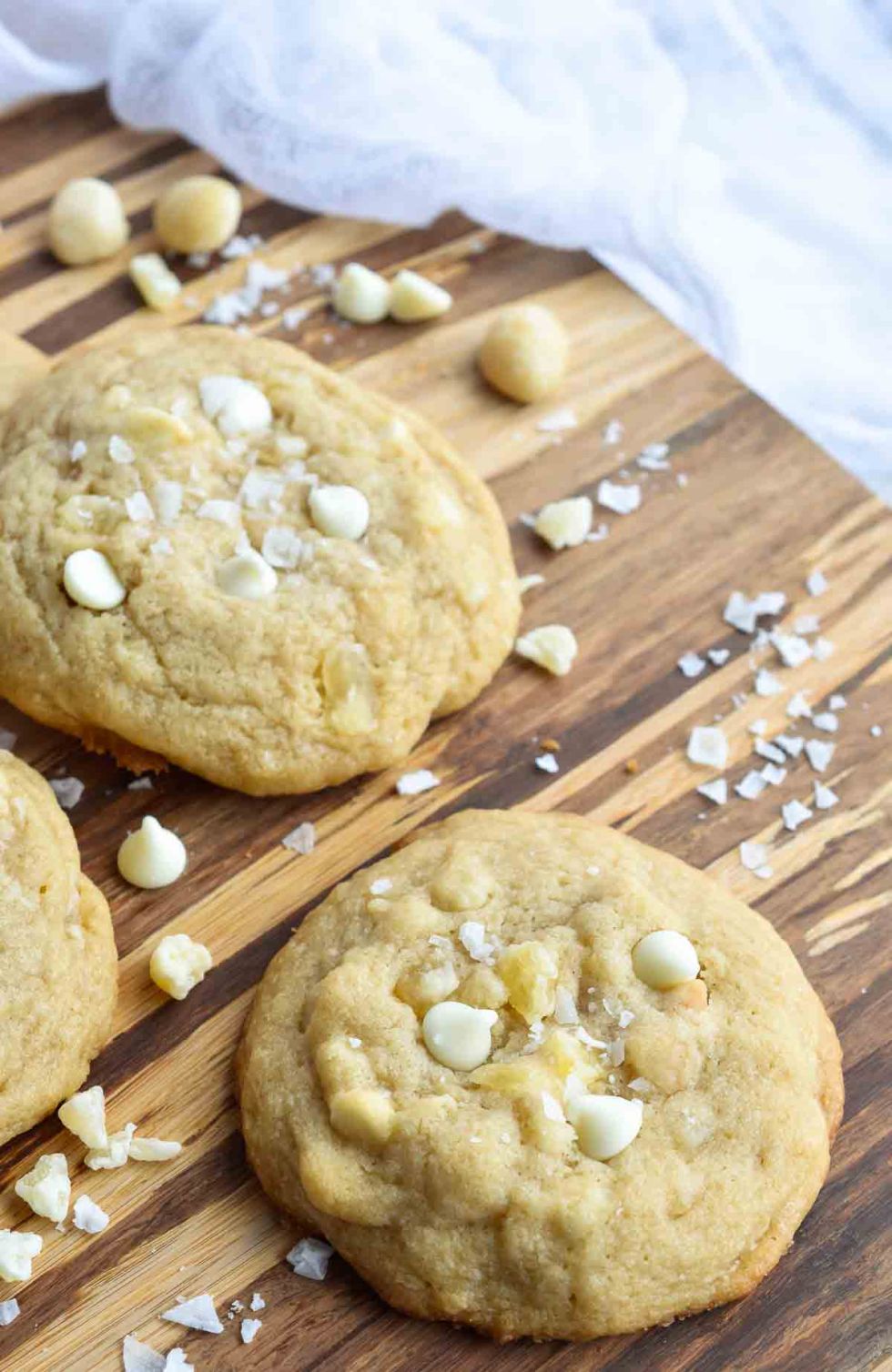 These Pineapple and White Chocolate Macadmia Nut Cookies are a great addition to any holiday dessert platter. This easy homemade cookie recipe is full of island flavor! Dried pineapple, white chocolate chips, macadamia nuts and flaked sea salt make the perfect combination.