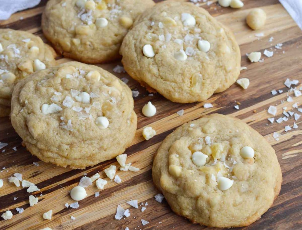 These Pineapple and White Chocolate Macadmia Nut Cookies are a great addition to any holiday dessert platter. This easy homemade cookie recipe is full of island flavor! Dried pineapple, white chocolate chips, macadamia nuts and flaked sea salt make the perfect combination.