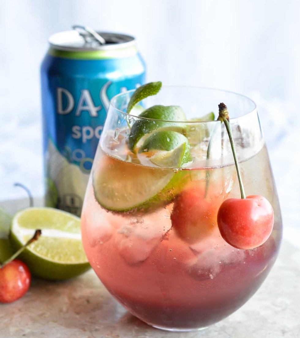 This Shirley Temple Cocktail Recipe is an easy and refreshing party drink. Also known as a Dirty Shirley; a blend of cherry, lime, rum or vodka and fizzy sparkling Dasani.