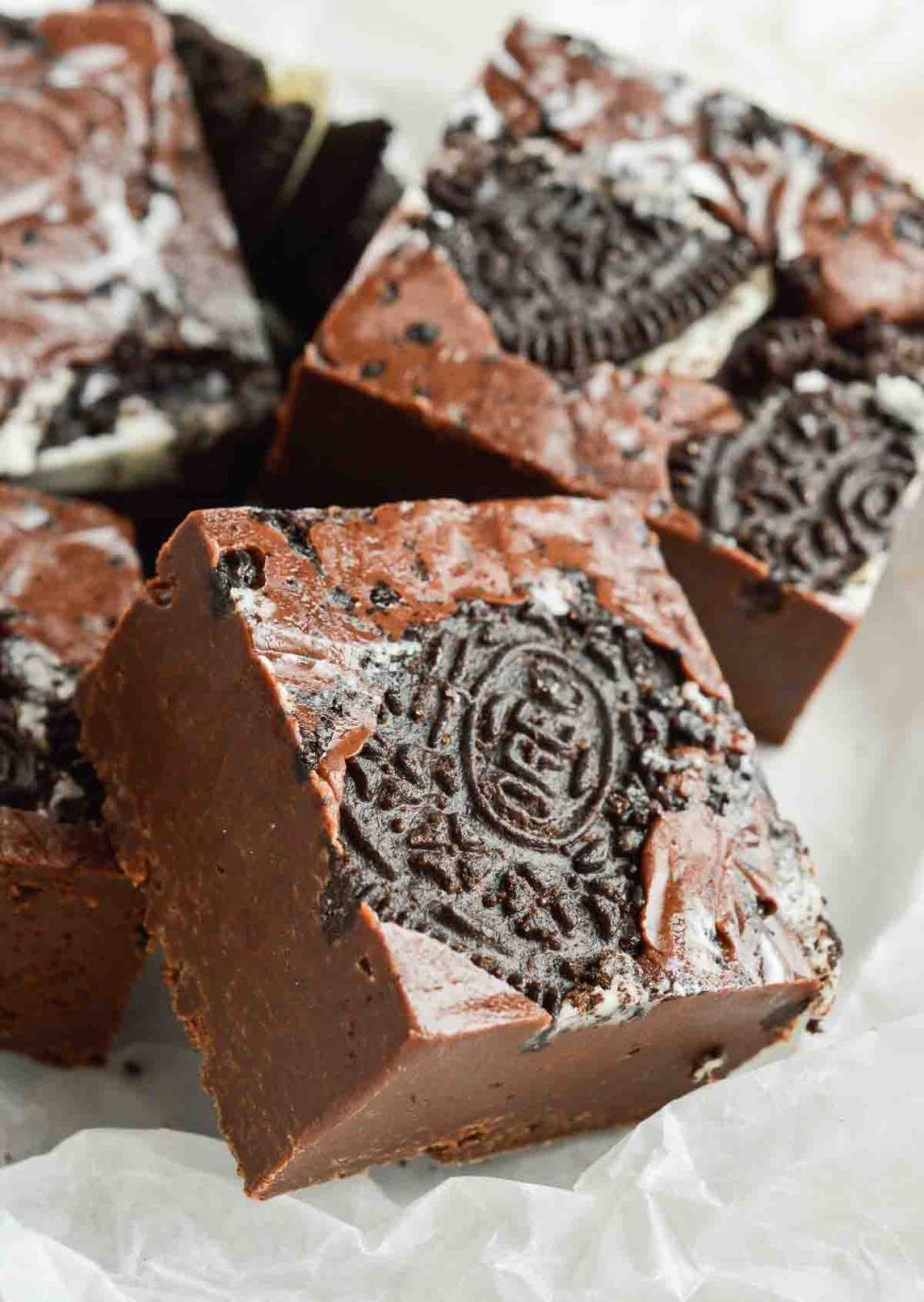 oreo fudge squares on parchment paper