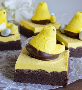 Peeps Chocolate Cake Bars Recipe - This fun and easy treat is perfect for an Easter Dessert! Delicious bars made with cake mix and topped with buttercream frosting. Decorate with Peeps and Robin's Eggs!