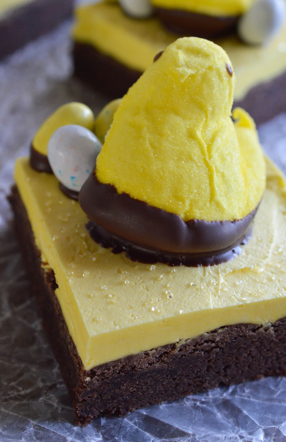 Peeps Chocolate Cake Bars Recipe - This fun and easy treat is perfect for an Easter Dessert! Delicious bars made with cake mix and topped with buttercream frosting. Decorate with Peeps and Robin's Eggs!