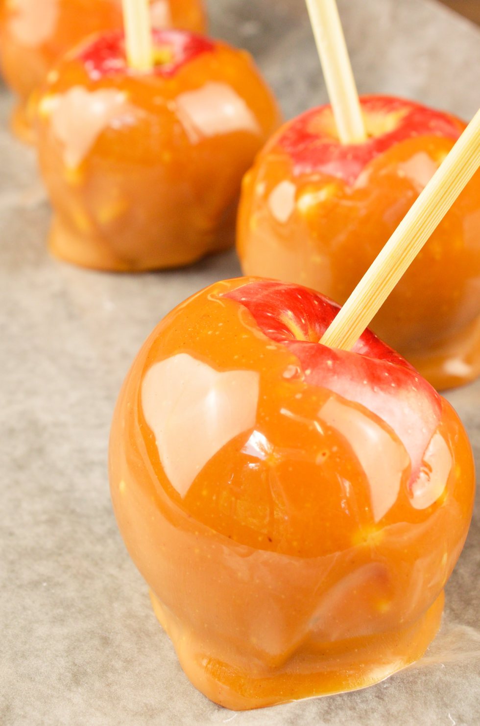 Make this favorite Fall dessert with just 3 ingredients in less than 15 minutes! This Easy Pumpkin Spiced Caramel Apples Recipe is great for Harvest festivals, holiday celebrations or as a Halloween treat. The kids can even help make this fun dessert!