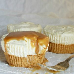 partially eaten small cheesecake topped with caramel