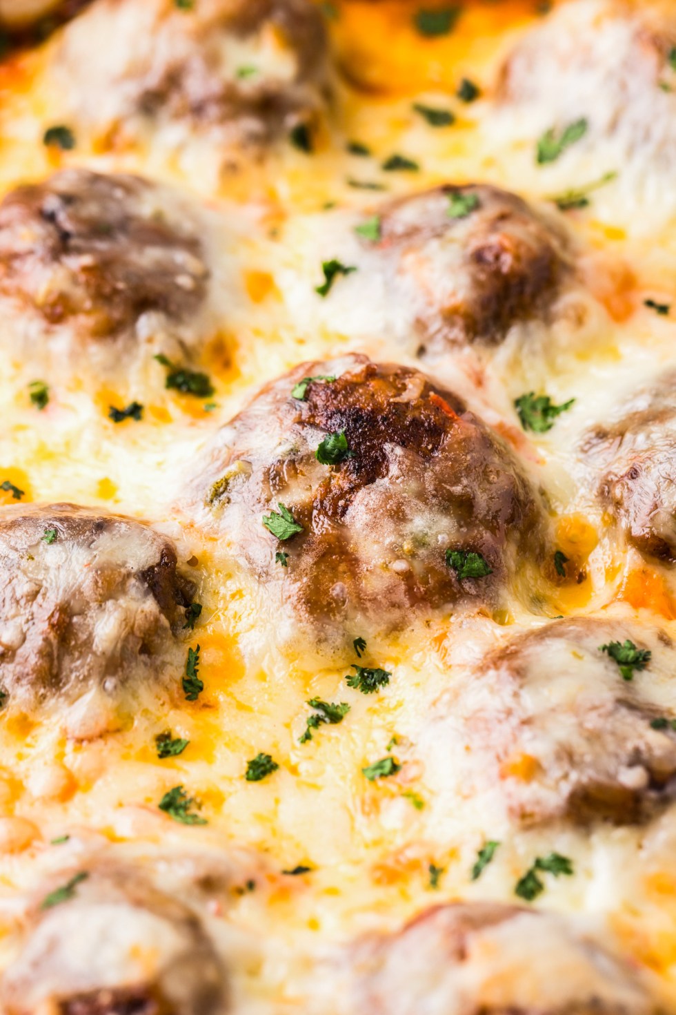 meatballs under melted cheese