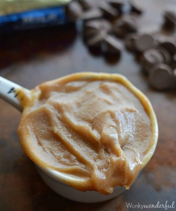 browned butter paste in white measuring cup