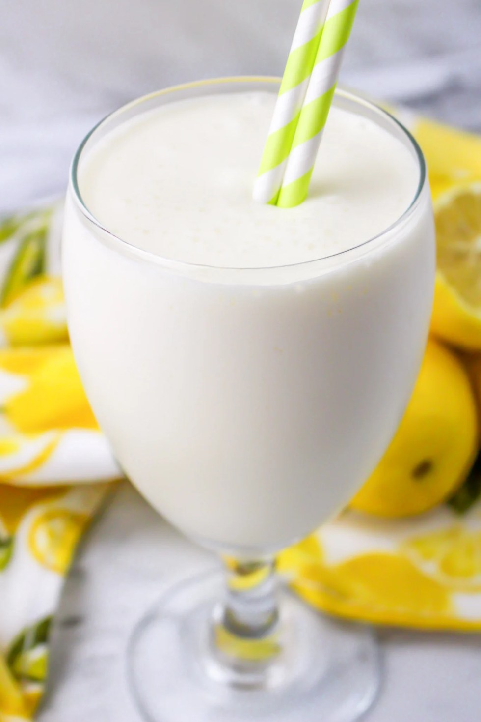 frozen white drink in clear glass