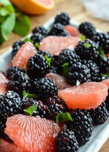 Start your day with this Easy Fresh Fruit Salad Recipe. A simple combination of sweet blackberries, tangy grapefruit, fresh mint and creamy Greek yogurt. The perfect healthy breakfast, snack or side dish!