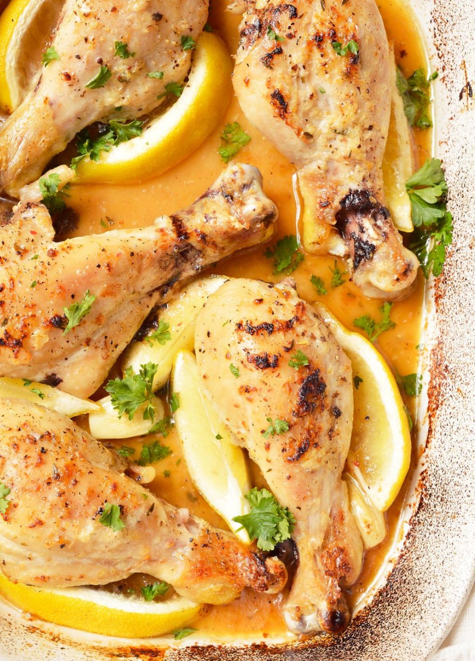 roasted chicken pieces in butter garlic lemon and parsley