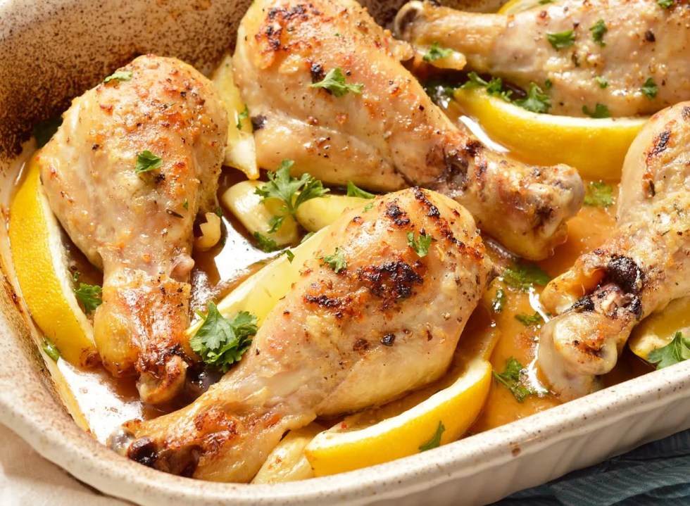 chicken drumstick lemon garlic parsley butter in roasting dish