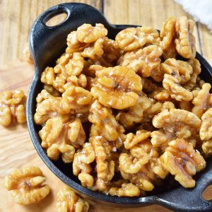 This Easy Maple Glazed Walnuts Recipe requires just 2 ingredients and couldn't get much more simple! These walnuts are lightly sweetened the natural way with pure maple syrup. Just bake, cool and enjoy alone, on salads or in a healthy snack mix!