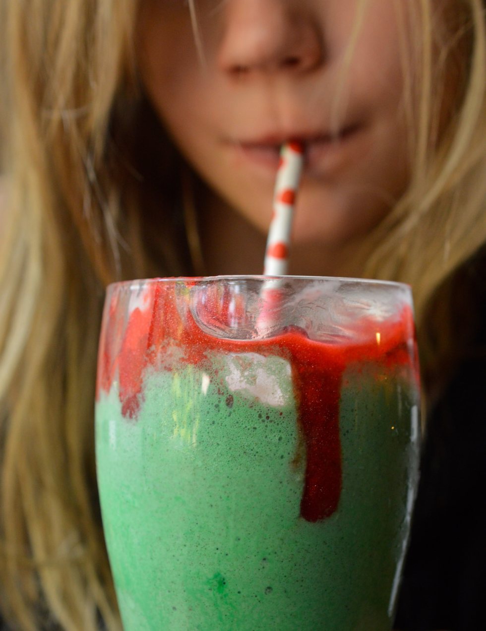 Make this Eye of Toad Halloween Milkshake Recipe for all of your creepy little monsters! This Halloween dessert is made with cookies and cream ice cream, green coloring, whipped cream, red blood gel and topped with a gummy eyeball. This fun recipe is kid approved!