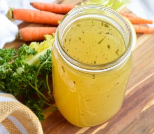 This Homemade Chicken Stock Recipe is so flavorful and easy to make. Just toss the ingredients into your slow cooker and forget about it. 12 hours later you have the most amazing chicken broth just waiting to be used!