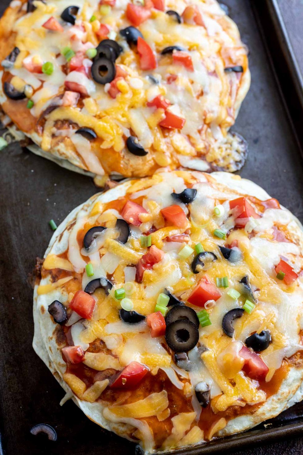 baked Mexican pizzas on baking sheet